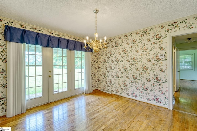 129 E Main St, Duncan, SC 29334 - unfurnished dining area with a chandelier, wood finished floors, crown molding, a textured ceiling, and baseboards
