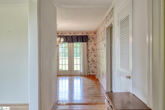 129 E Main St, Duncan, SC 29334 - hall with a textured ceiling, wallpapered walls, light wood finished floors, ornamental molding, and baseboards