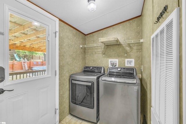 118 Quail Rd, Ninety Six, SC 29666 - laundry room with a heating unit, washing machine and clothes dryer, ornamental molding, and light tile patterned flooring