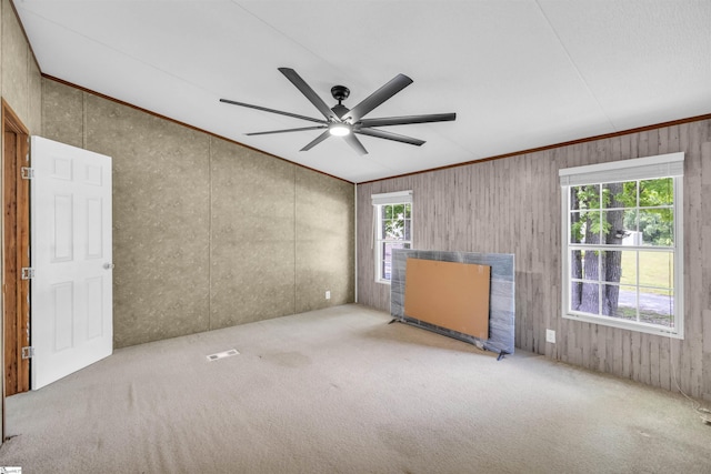 118 Quail Rd, Ninety Six, SC 29666 - carpeted empty room featuring ceiling fan, crown molding, wood walls, and vaulted ceiling