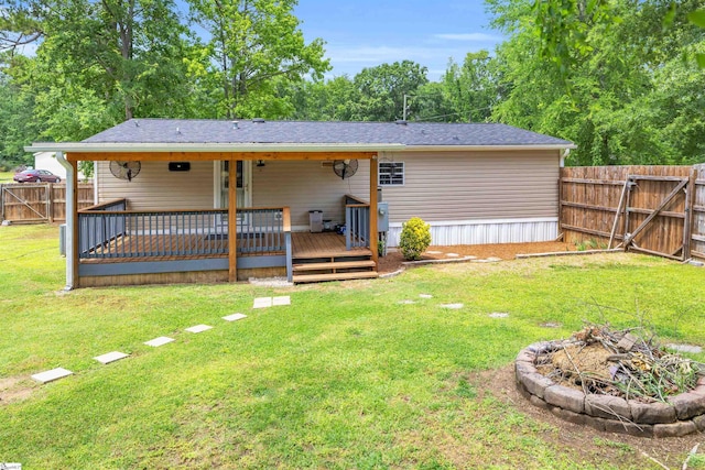 118 Quail Rd, Ninety Six, SC 29666 - back of property featuring an outdoor fire pit, a gate, and a deck