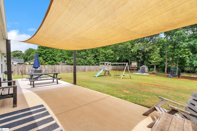 205 Glastonbury Dr, Greer, SC 29651 - view of patio with a playground, outdoor dining area, and view of wooded area