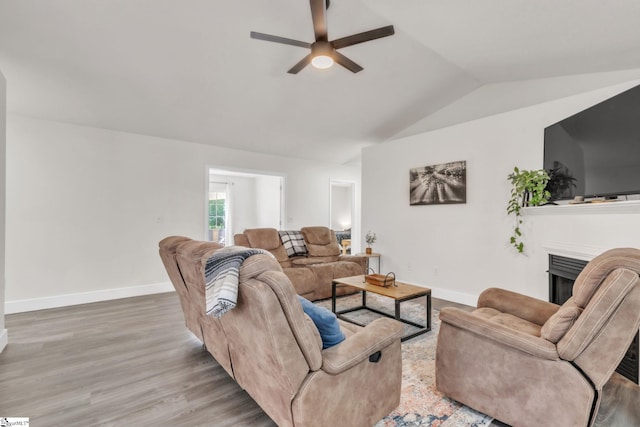 205 Glastonbury Dr, Greer, SC 29651 - living area featuring ceiling fan, lofted ceiling, a fireplace, baseboards, and wood finished floors
