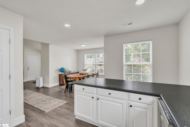 205 Glastonbury Dr, Greer, SC 29651 - kitchen featuring dark countertops, white cabinets, recessed lighting, and wood finished floors