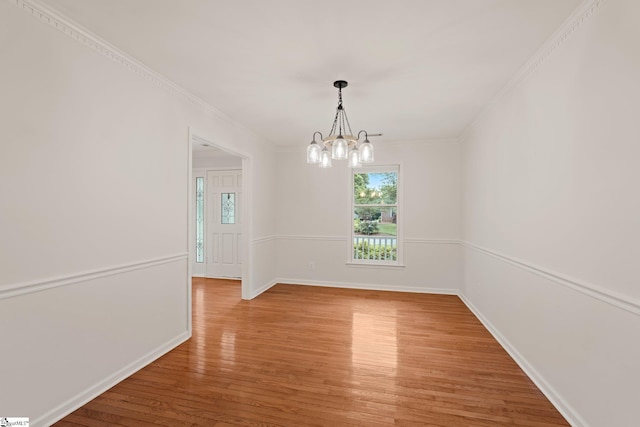 113 Roberts Farm Rd, Simpsonville, SC 29681 - unfurnished dining area with light wood-style flooring, a chandelier, baseboards, and ornamental molding