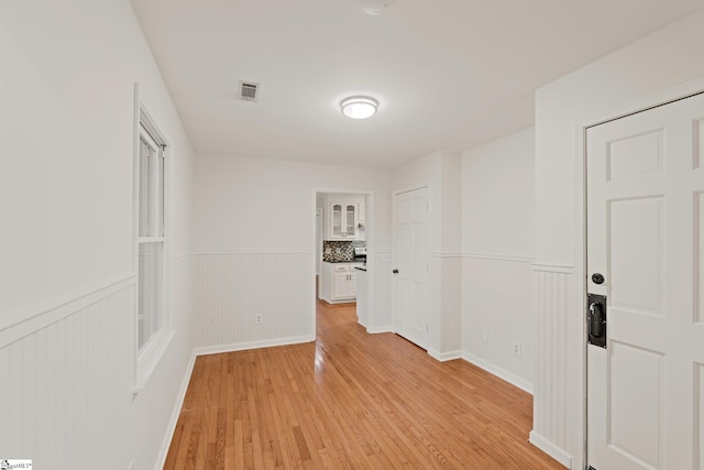 113 Roberts Farm Rd, Simpsonville, SC 29681 - hall with a wainscoted wall and light wood-type flooring