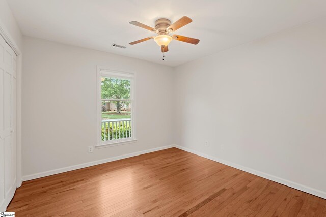 113 Roberts Farm Rd, Simpsonville, SC 29681 - unfurnished bedroom with wood finished floors, a closet, baseboards, and ceiling fan