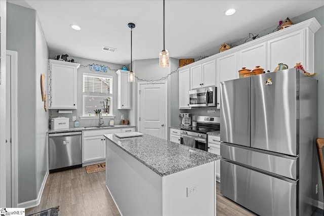 610 Circinae Rd, Cowpens, SC 29330 - kitchen featuring stainless steel appliances, white cabinets, light wood-style floors, and recessed lighting