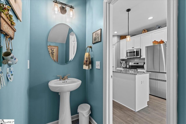 610 Circinae Rd, Cowpens, SC 29330 - bathroom with wood finished floors, baseboards, recessed lighting, and a sink