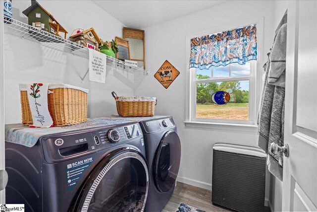 610 Circinae Rd, Cowpens, SC 29330 - laundry area with separate washer and dryer, wood finished floors, and baseboards
