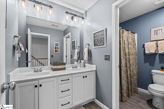 610 Circinae Rd, Cowpens, SC 29330 - full bath with toilet, wood finished floors, double vanity, baseboards, and curtained shower