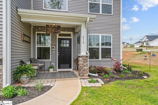 610 Circinae Rd, Cowpens, SC 29330 - view of exterior entry with a porch, a lawn, and stone siding