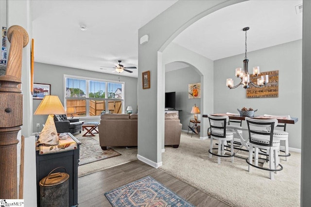 610 Circinae Rd, Cowpens, SC 29330 - living room featuring ceiling fan, arched walkways, wood finished floors, a chandelier, and baseboards