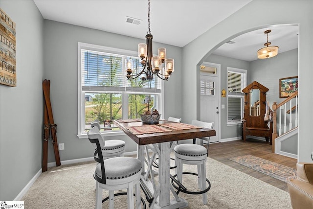 610 Circinae Rd, Cowpens, SC 29330 - dining space featuring arched walkways, a chandelier, and healthy amount of natural light