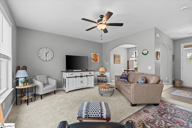 610 Circinae Rd, Cowpens, SC 29330 - carpeted living area with arched walkways, a ceiling fan, baseboards, and a chandelier