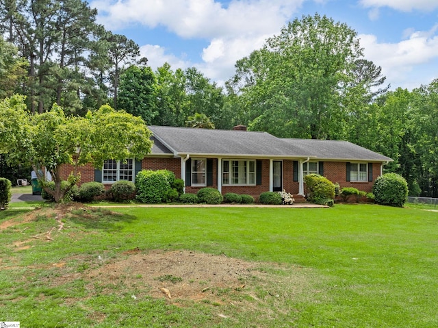 221 N Hill Dr, Boiling Springs, SC 29316 - ranch-style house with brick siding, a front lawn, and a chimney