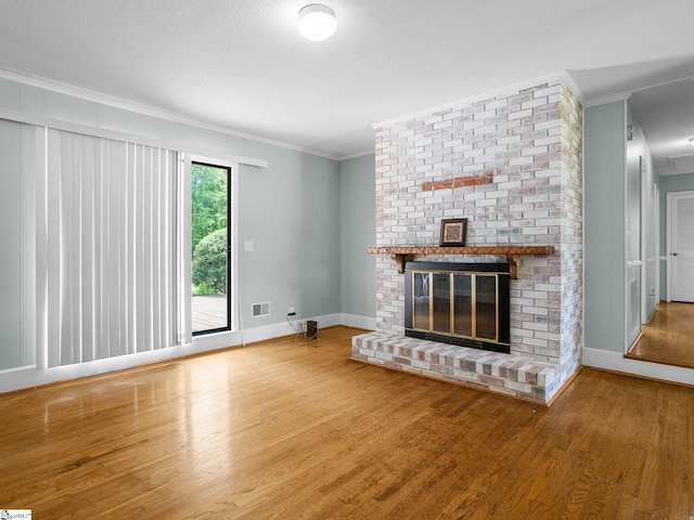 221 N Hill Dr, Boiling Springs, SC 29316 - unfurnished living room with crown molding, wood finished floors, a fireplace, and baseboards