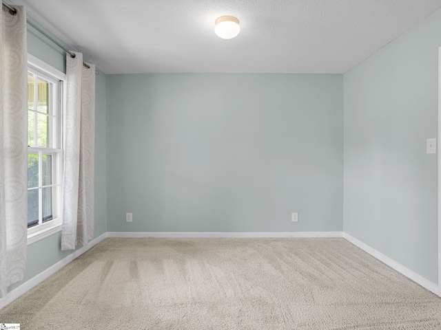 221 N Hill Dr, Boiling Springs, SC 29316 - carpeted spare room with baseboards and a textured ceiling