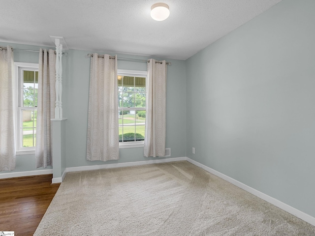 221 N Hill Dr, Boiling Springs, SC 29316 - spare room featuring a textured ceiling, baseboards, and wood finished floors