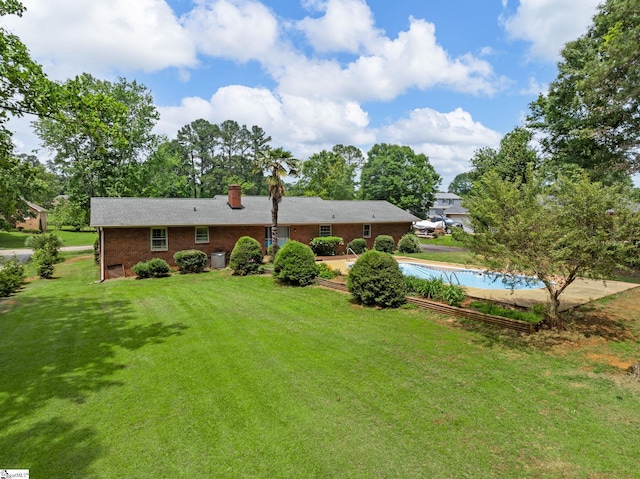 221 N Hill Dr, Boiling Springs, SC 29316 - rear view of house featuring brick siding, a chimney, and a yard