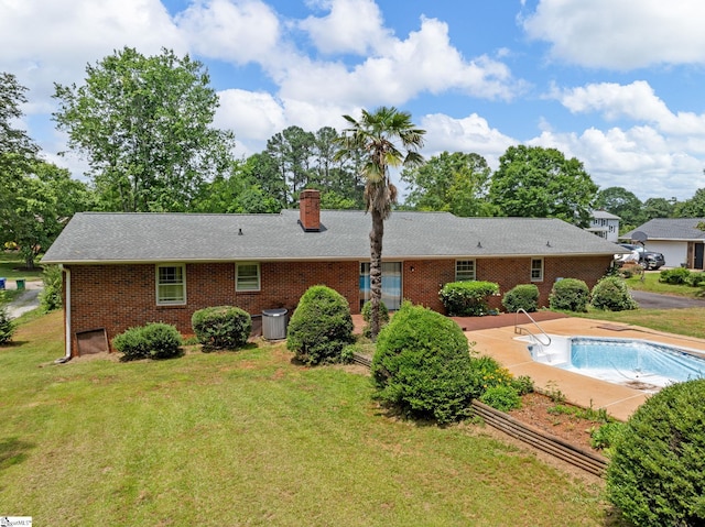 221 N Hill Dr, Boiling Springs, SC 29316 - back of house featuring brick siding, a lawn, a chimney, a patio, and an empty pool