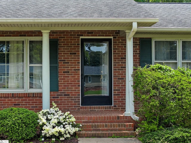 221 N Hill Dr, Boiling Springs, SC 29316 - view of exterior entry featuring a shingled roof and brick siding