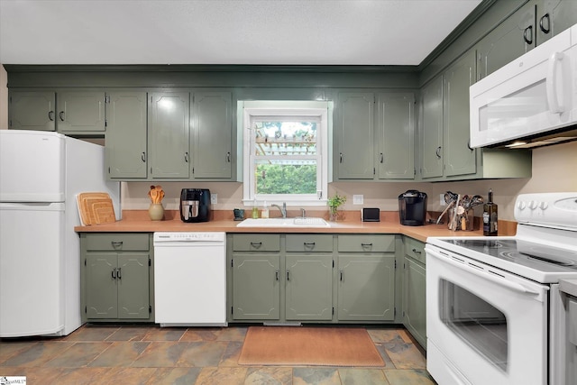108 Hancock Ln, Greer, SC 29650 - kitchen featuring white appliances, a sink, green cabinetry, light countertops, and stone finish floors