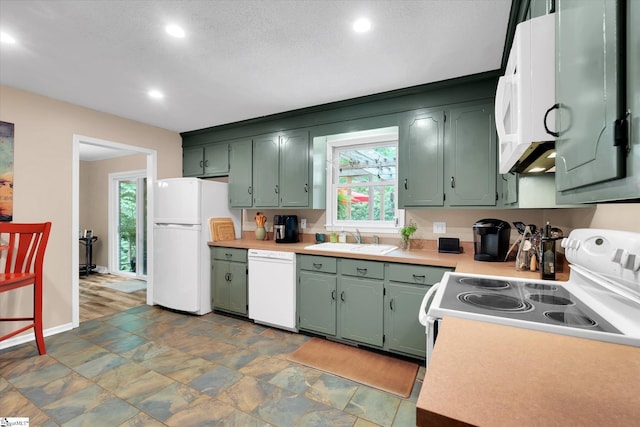 108 Hancock Ln, Greer, SC 29650 - kitchen with white appliances, a sink, green cabinets, light countertops, and recessed lighting