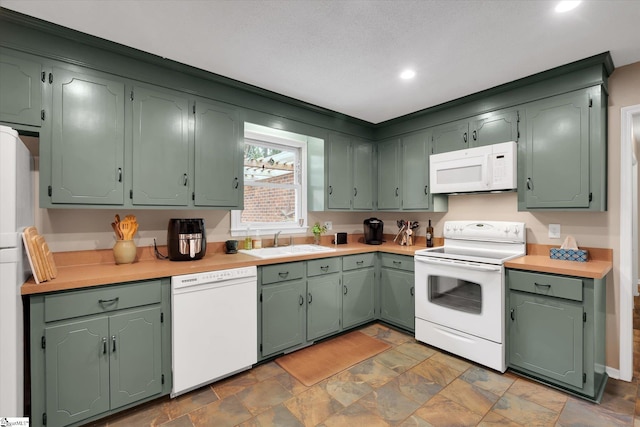108 Hancock Ln, Greer, SC 29650 - kitchen featuring white appliances, a sink, stone finish floors, light countertops, and recessed lighting