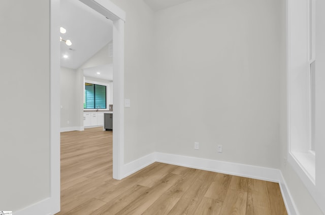 120 Thomason View Rd, Fountain Inn, SC 29644 - spare room featuring light wood finished floors, baseboards, vaulted ceiling, and recessed lighting