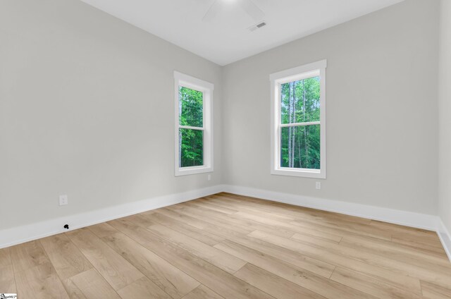 120 Thomason View Rd, Fountain Inn, SC 29644 - empty room with light wood finished floors, ceiling fan, and baseboards
