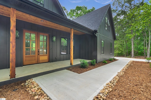 120 Thomason View Rd, Fountain Inn, SC 29644 - entrance to property featuring board and batten siding, a shingled roof, and covered porch