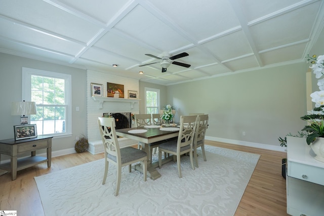 251 Williams Rd, Pelzer, SC 29669 - dining area featuring coffered ceiling, baseboards, light wood-type flooring, ceiling fan, and a brick fireplace