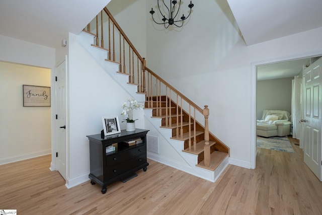 251 Williams Rd, Pelzer, SC 29669 - stairway featuring wood finished floors, a chandelier, and baseboards