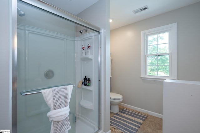 251 Williams Rd, Pelzer, SC 29669 - bathroom with a shower stall, toilet, baseboards, and tile patterned flooring