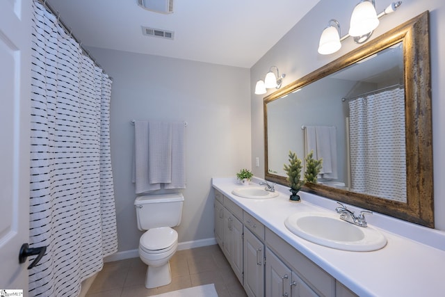 251 Williams Rd, Pelzer, SC 29669 - full bathroom featuring toilet, tile patterned floors, double vanity, and baseboards