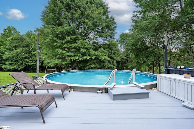 251 Williams Rd, Pelzer, SC 29669 - swimming pool featuring a deck and view of wooded area