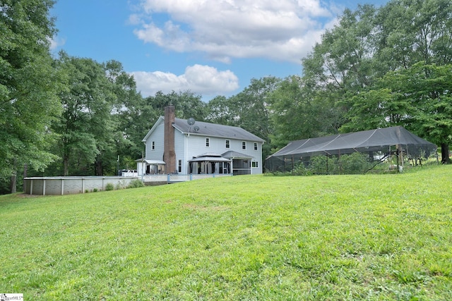 251 Williams Rd, Pelzer, SC 29669 - rear view of house with a gazebo, an outdoor pool, a chimney, and a lawn