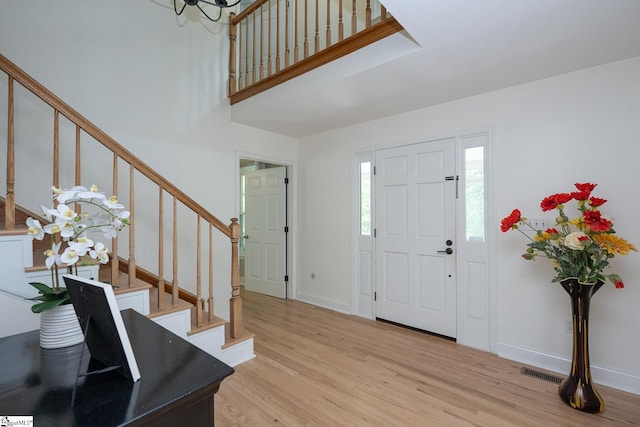 251 Williams Rd, Pelzer, SC 29669 - entryway with wood finished floors, stairway, baseboards, and a chandelier