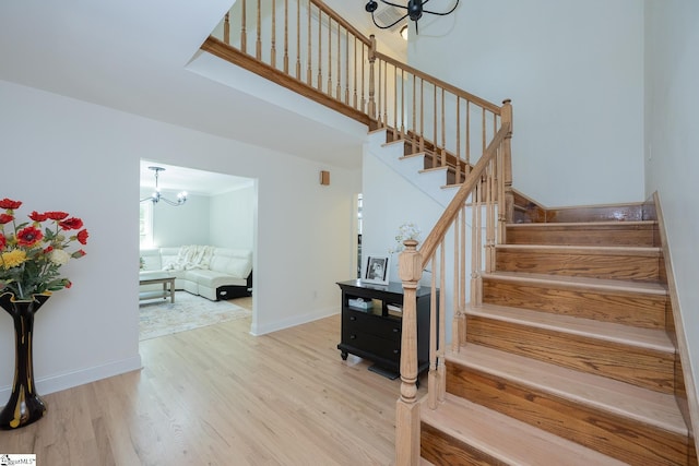 251 Williams Rd, Pelzer, SC 29669 - stairs featuring a chandelier, wood finished floors, and baseboards