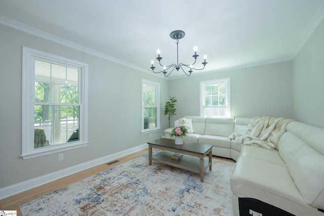 251 Williams Rd, Pelzer, SC 29669 - living area with a chandelier, ornamental molding, baseboards, and light wood finished floors