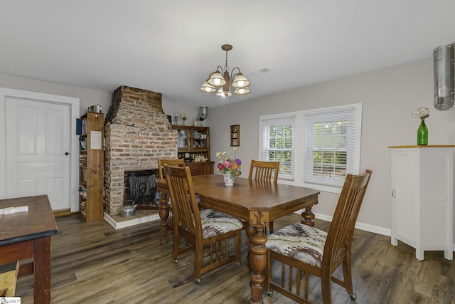 2444 Abner Creek Rd, Duncan, SC 29334 - dining room with wood finished floors, a chandelier, and baseboards