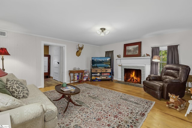 2444 Abner Creek Rd, Duncan, SC 29334 - living room with wood finished floors, crown molding, and a brick fireplace