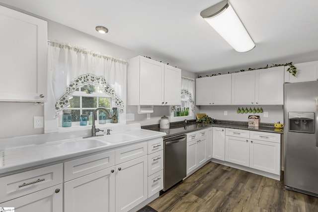 2444 Abner Creek Rd, Duncan, SC 29334 - kitchen with appliances with stainless steel finishes, white cabinets, a sink, and dark wood finished floors