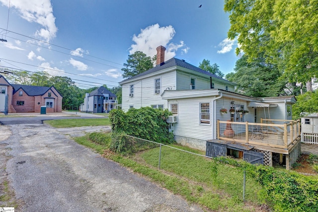 600 Gulliver St, Fountain Inn, SC 29644 - view of side of home with a deck and a chimney