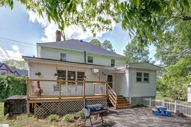 600 Gulliver St, Fountain Inn, SC 29644 - rear view of property with a chimney, a wooden deck, and a patio