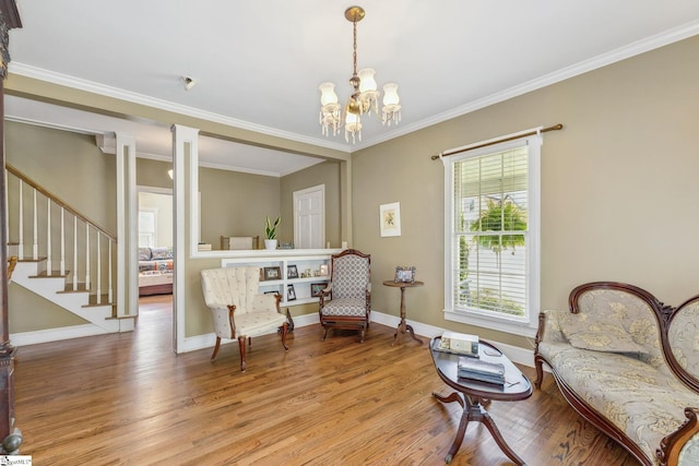 600 Gulliver St, Fountain Inn, SC 29644 - living area with wood finished floors, a chandelier, stairway, decorative columns, and baseboards