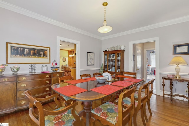 600 Gulliver St, Fountain Inn, SC 29644 - dining space featuring ornamental molding, dark wood-style flooring, and a wainscoted wall