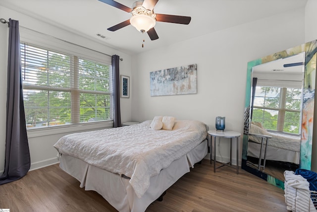 508 W D Ave, Easley, SC 29640 - bedroom featuring baseboards, multiple windows, and wood finished floors