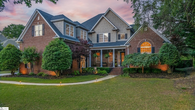204 Whitworth Way, Simpsonville, SC 29681 - view of front of property with covered porch, a lawn, and brick siding